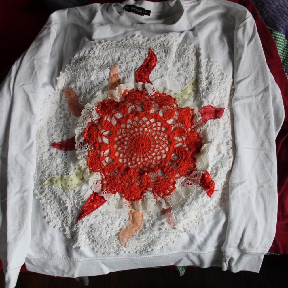Upcycled White Sweatshirt with Intricate patchwork Sun Design